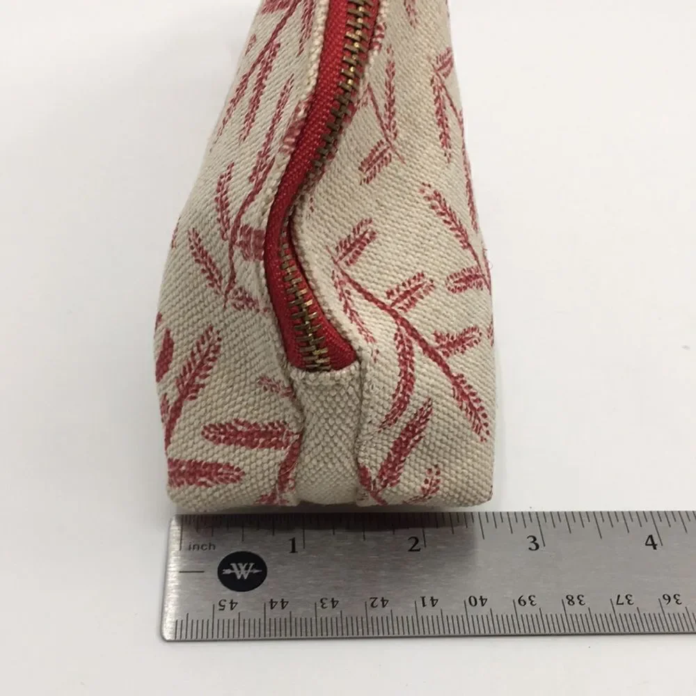 FEED 10 Clarins makeup cosmetics light tan and red carry-all pouch